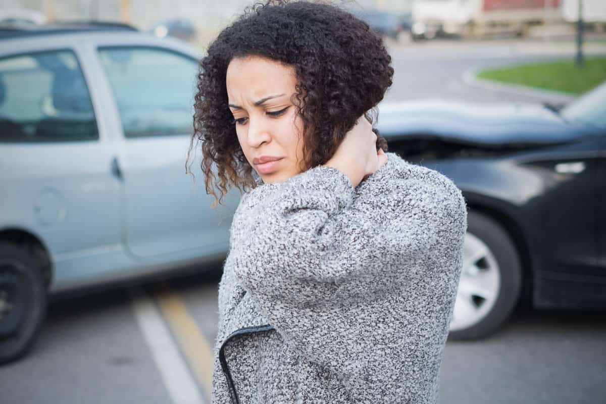 woman rubbing her neck after a car accident las vegas
